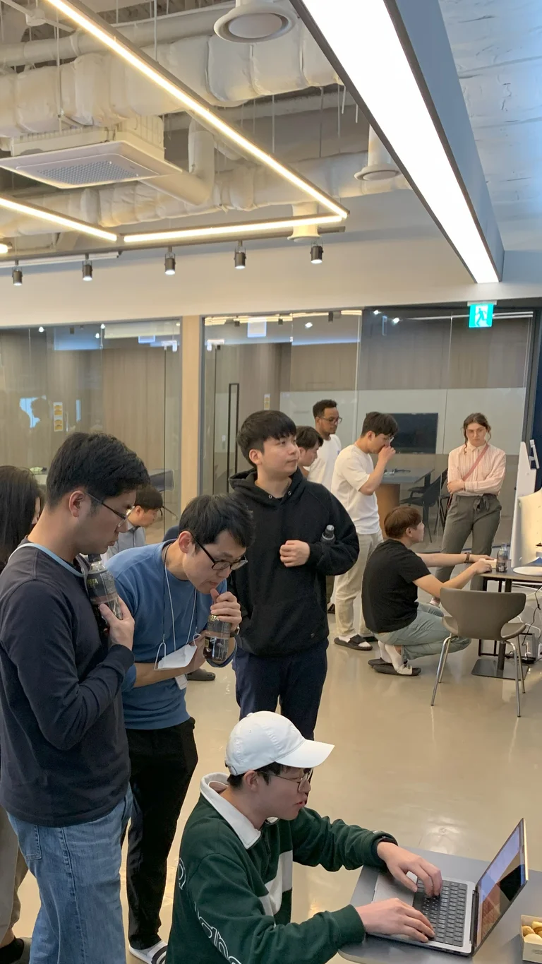 Employees of ThorDrive attending presentation of colleagues' work