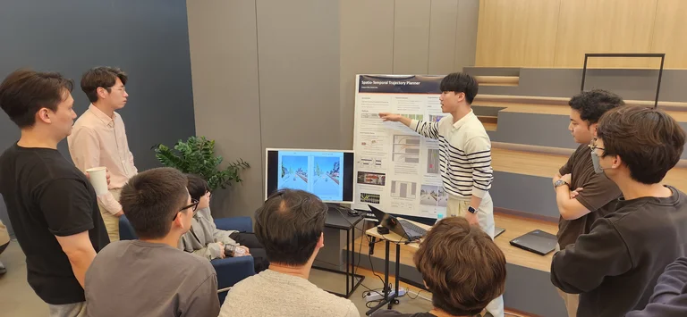 The employees at ThorDrive are focusing on other one's presentation.
